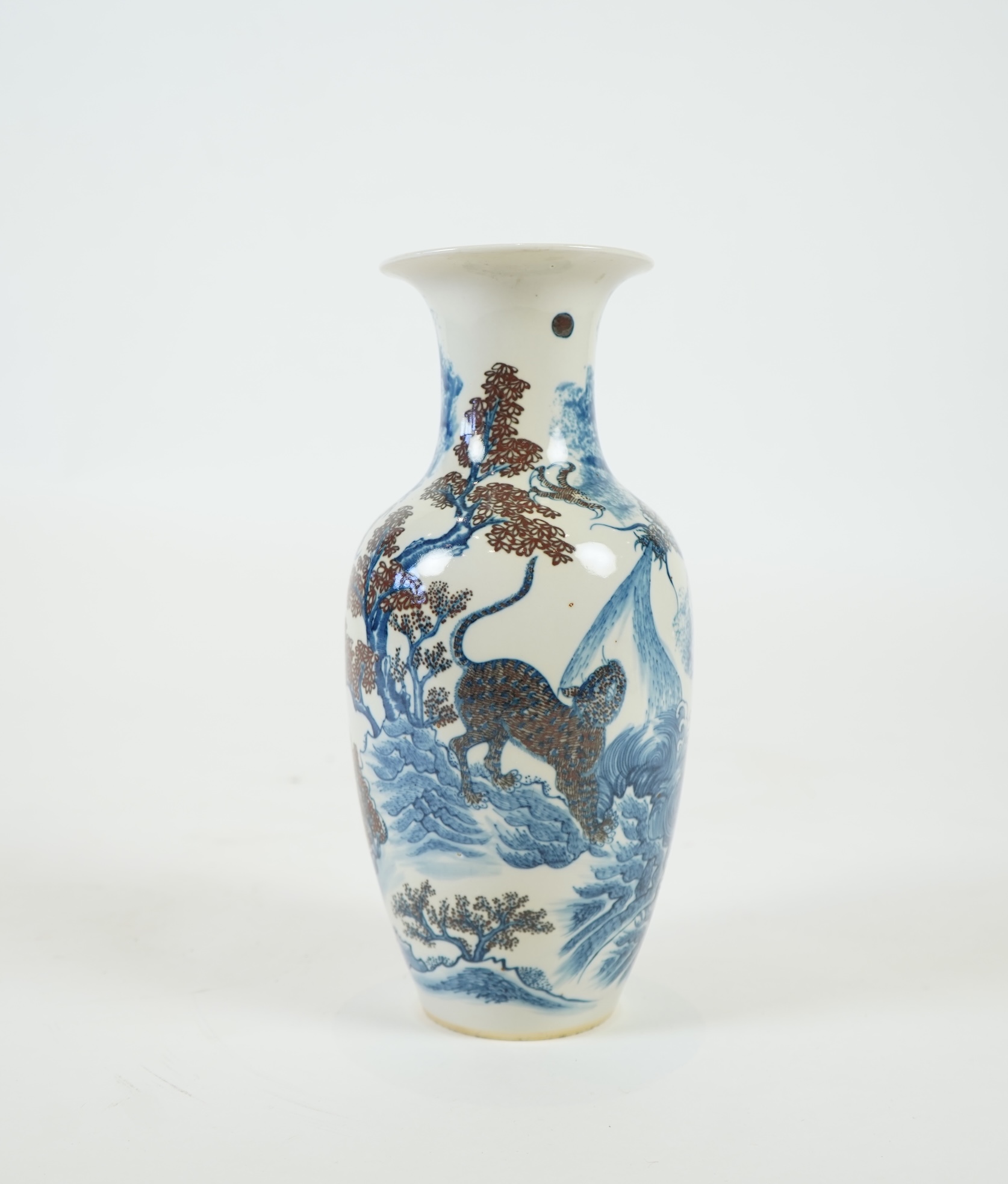 A Chinese underglaze blue and copper red ’dragon and tiger’ baluster vase, possibly 19th century